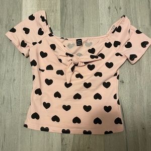 Pink shirt with black hearts and cute little bow